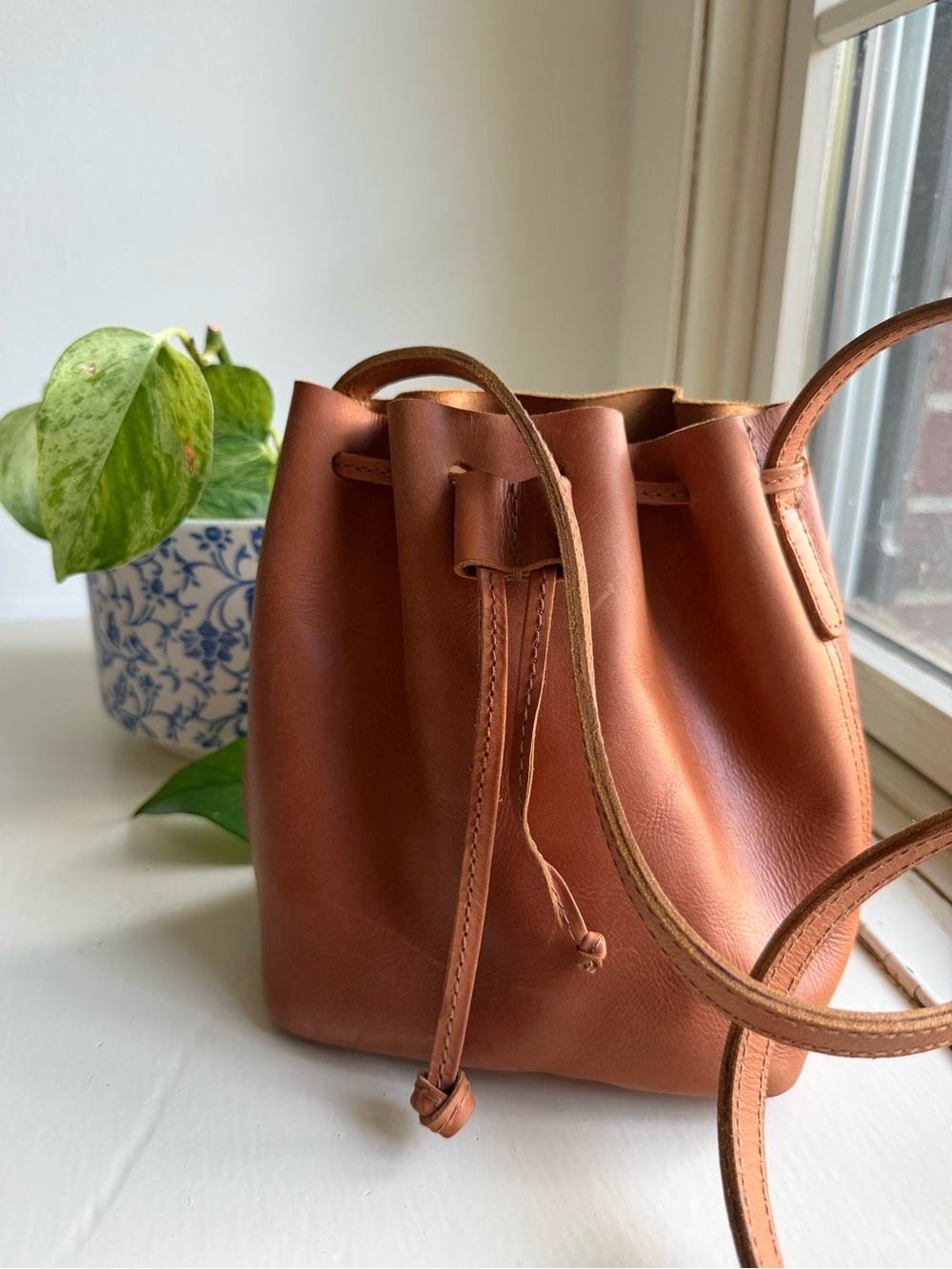 Parker Clay Leather Drawstring Bucket Bag in Rust Brown